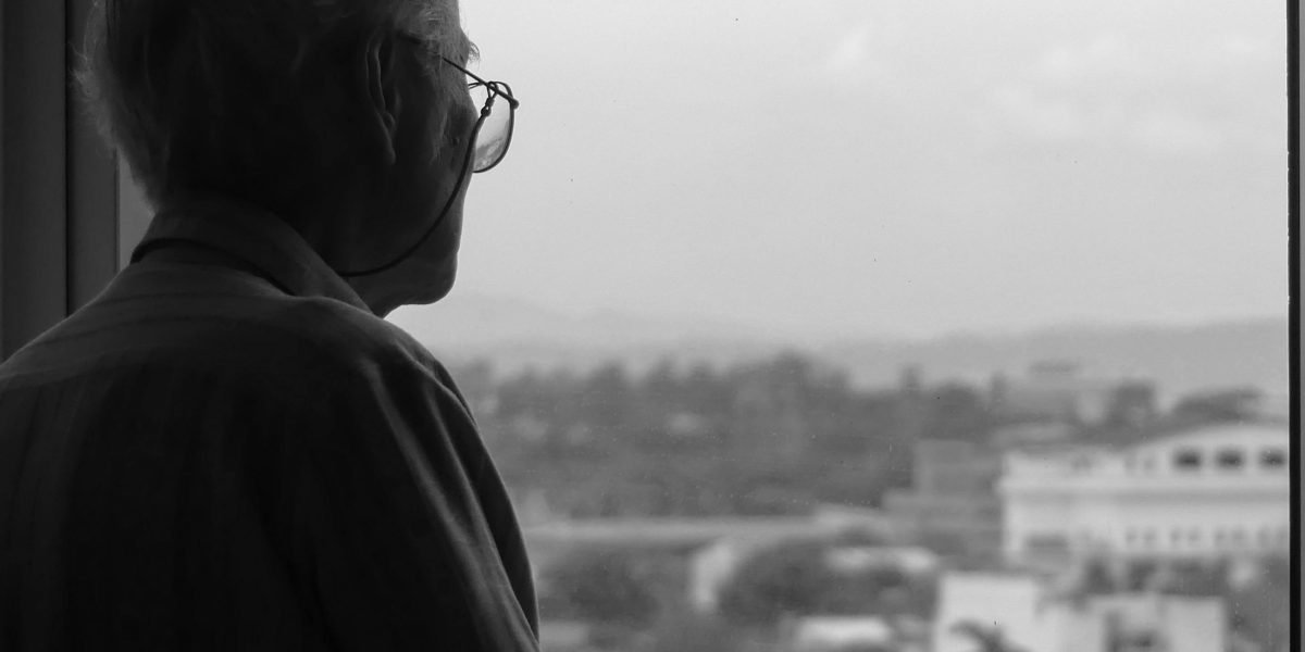 A person contemplating strategic choices related to high-value real estate investment in a dynamic city.