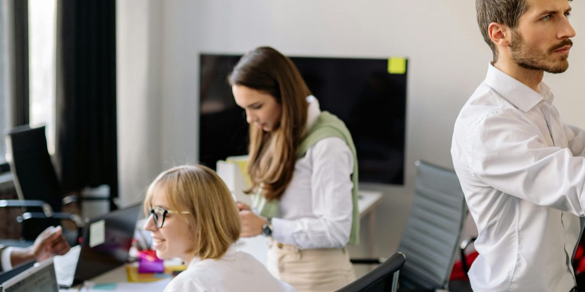 A team actively brainstorming and outlining plans on a whiteboard, reflecting the structured hiring process.