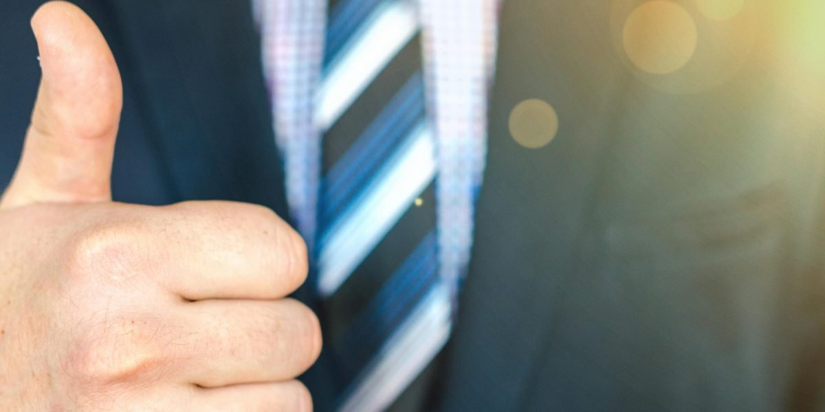 A confident individual symbolizing a wise investment choice and the positive outcomes of partnering with a reputable real estate company.