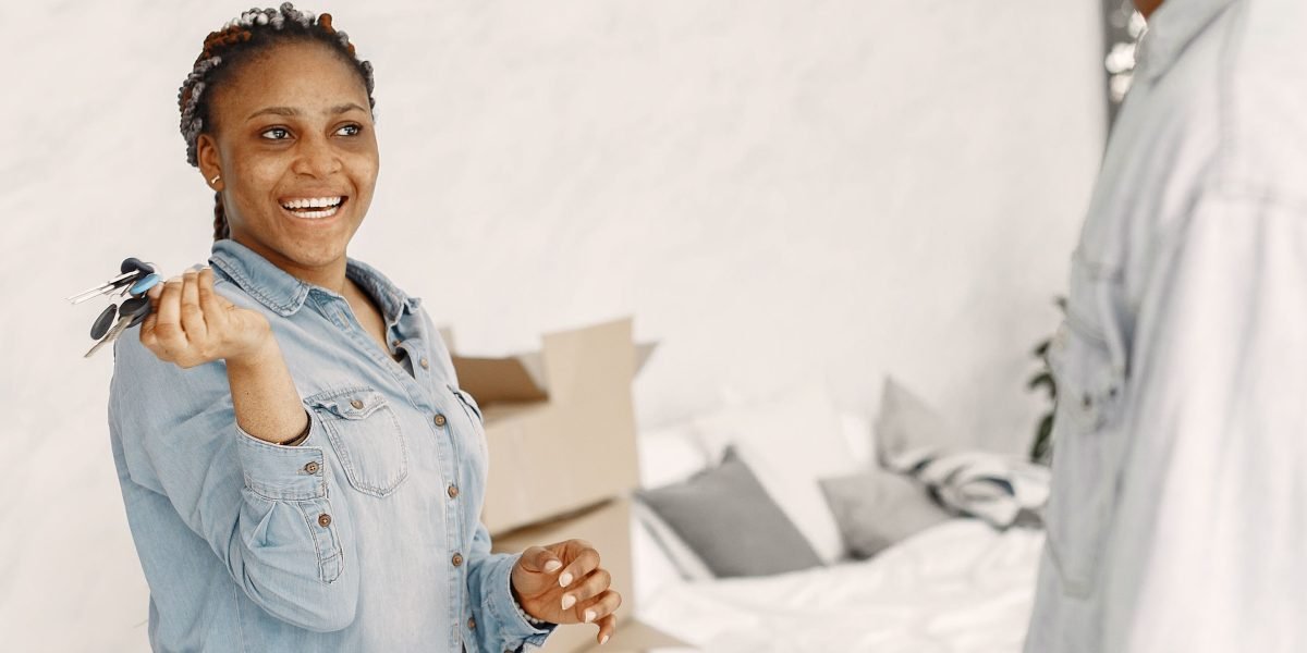 The joyous moment of receiving keys to a new property, symbolizing ownership and new beginnings.