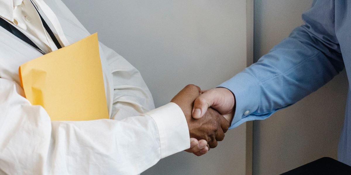Professionals concluding a legal agreement, symbolizing the transfer of property ownership in Dubai.