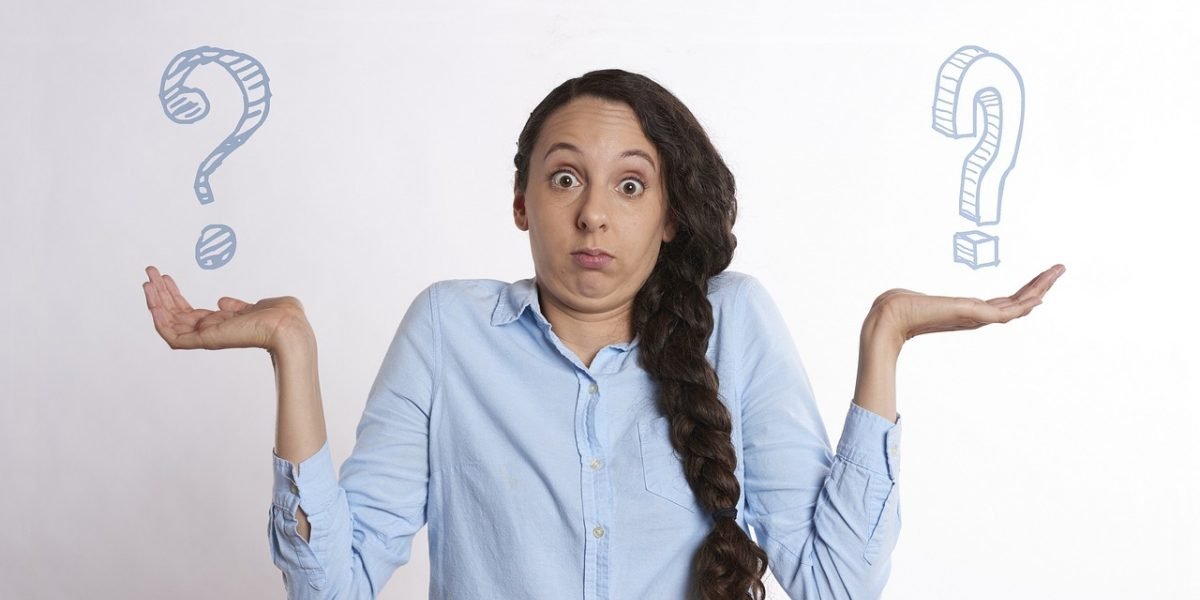 A person thoughtfully considers their options, symbolizing the careful deliberation required for making a final decision on a property broker.