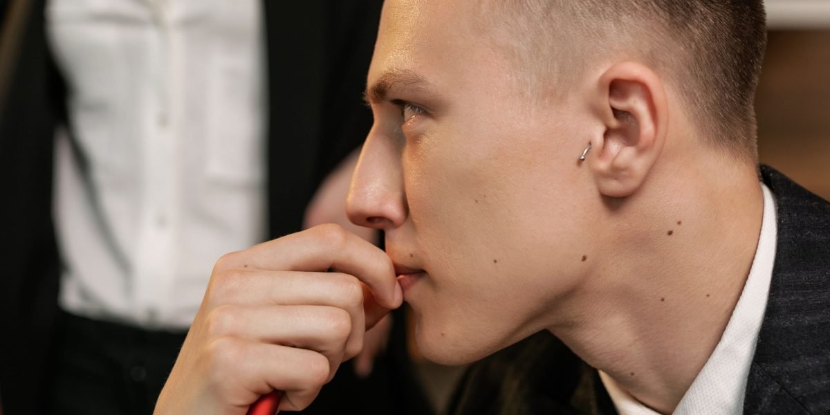 A person in deep thought, reflecting on significant investment decisions.