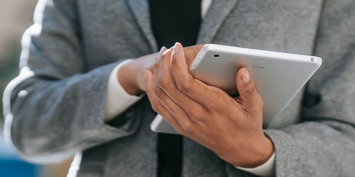 A person confidently managing their investments remotely, enjoying freedom and flexibility.
