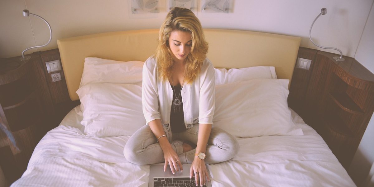 A person on a video call, confidently managing property finances and operations from a distance, illustrating remote property management.