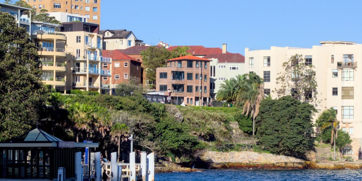 A stunning view of a modern city skyline against a serene waterfront, embodying luxury living.