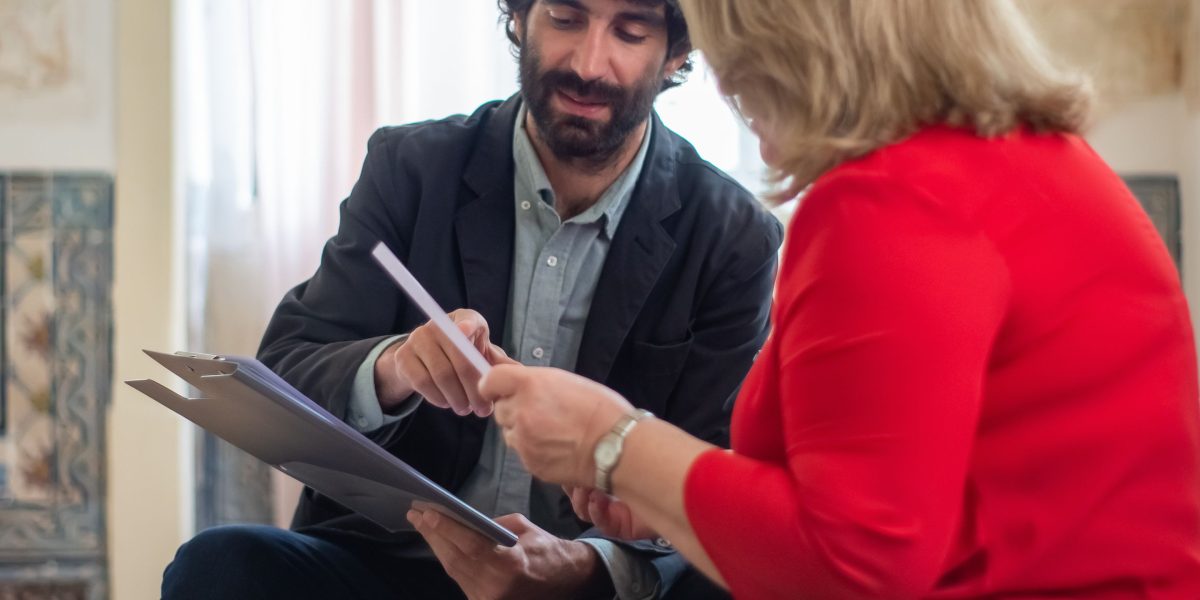 A real estate professional advising a client on property ownership options.