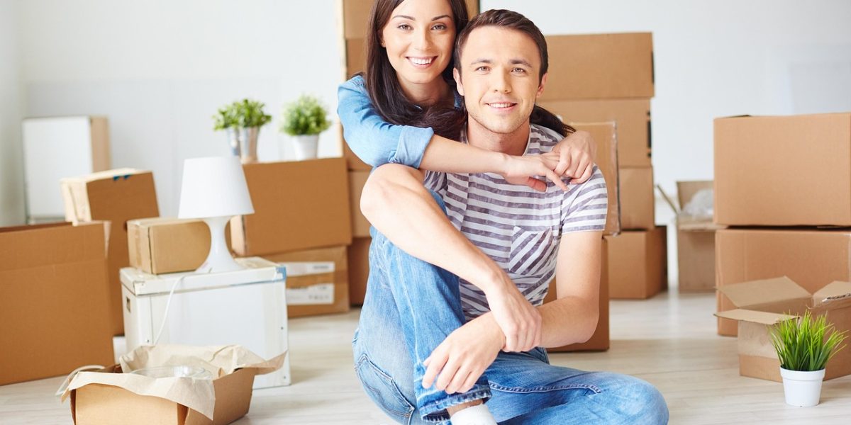 A happy family celebrating moving into their new home, symbolizing residency benefits.