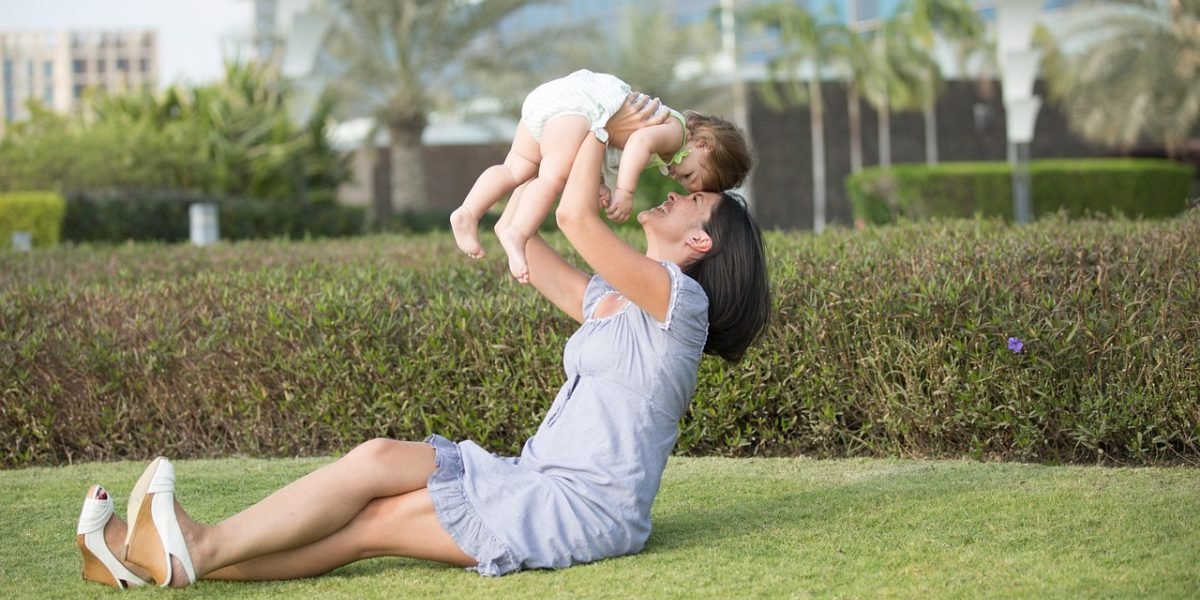 A family relaxing and playing together in a private garden.