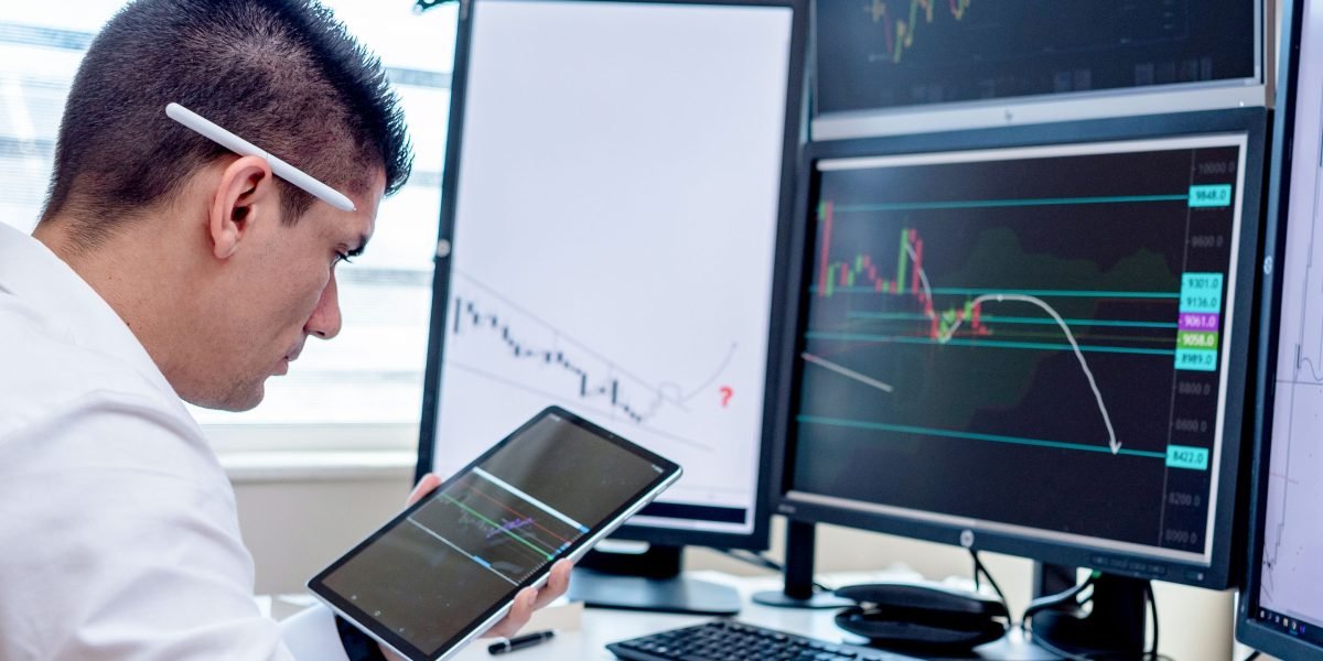 A global investor reviewing financial reports on a tablet from a distant location, illustrating effective remote property management.