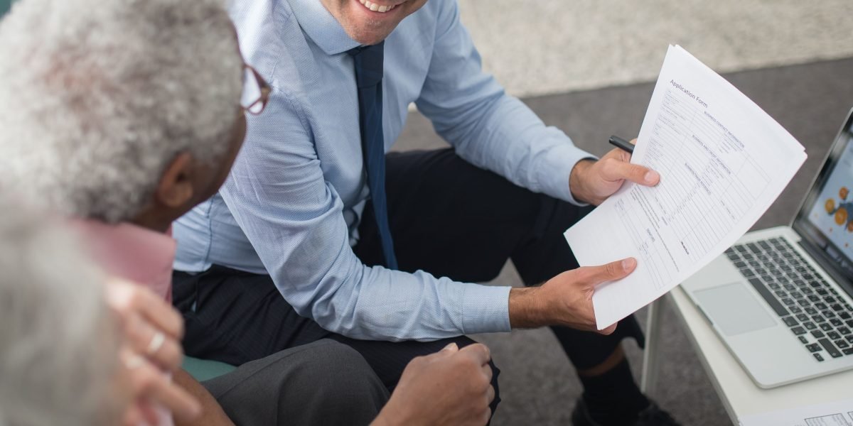 A couple consults with an advisor to align their property aspirations with their budget in Dubai's diverse market.