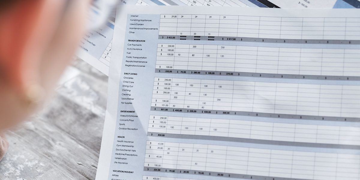 A professional reviewing financial documents, reflecting the detailed analysis of investment returns and financing options.