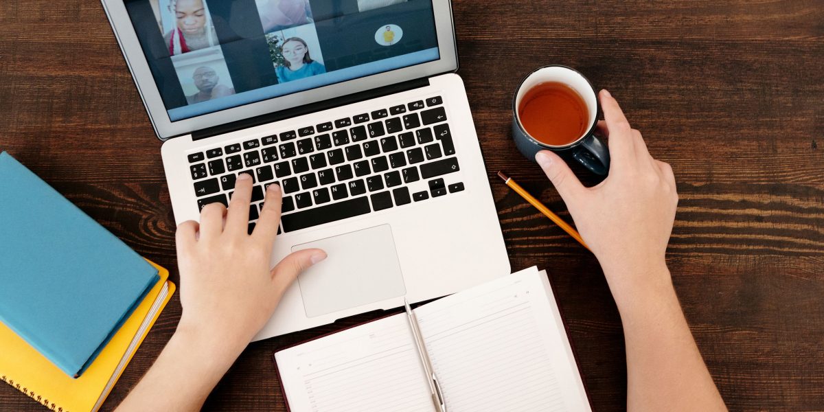 A professional engaging in a video call, effectively managing tasks remotely.