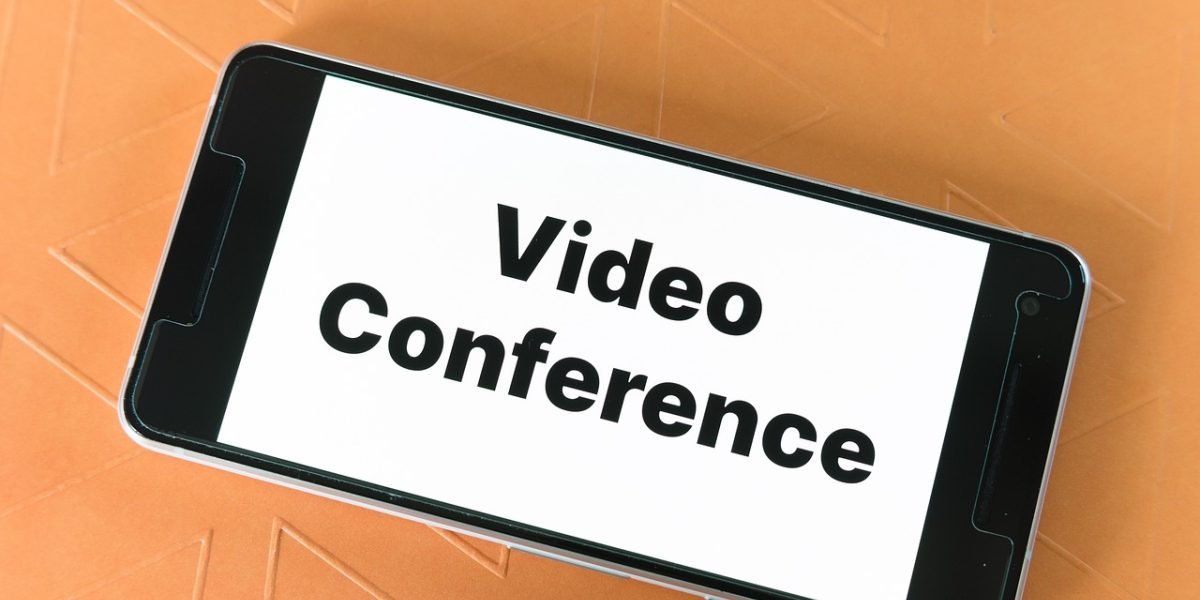 A person engaging in a video call, illustrating how remote owners can manage their Dubai property with professional help.