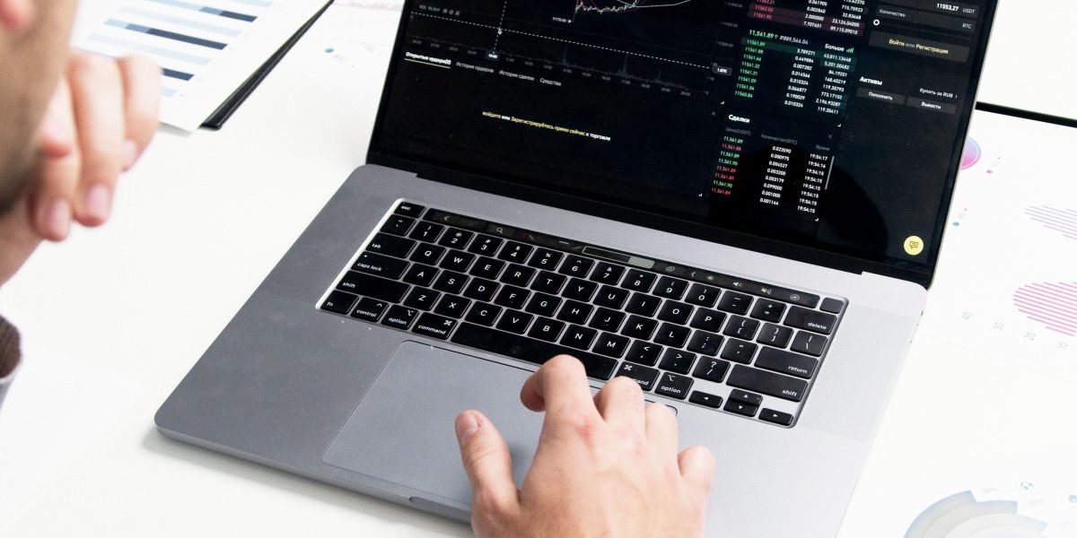 Individuals analyzing financial documents and planning for investment outcomes and risk mitigation.